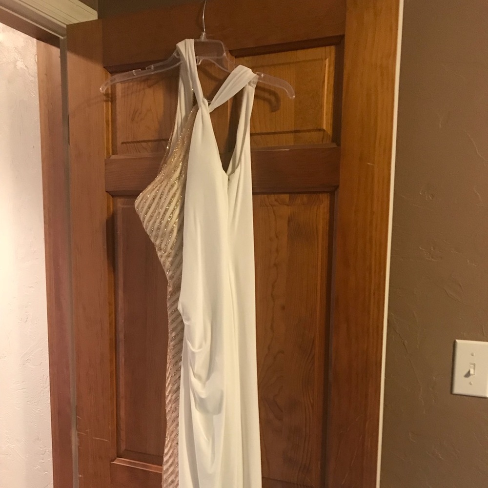 Long white with gold side accents evening gown.